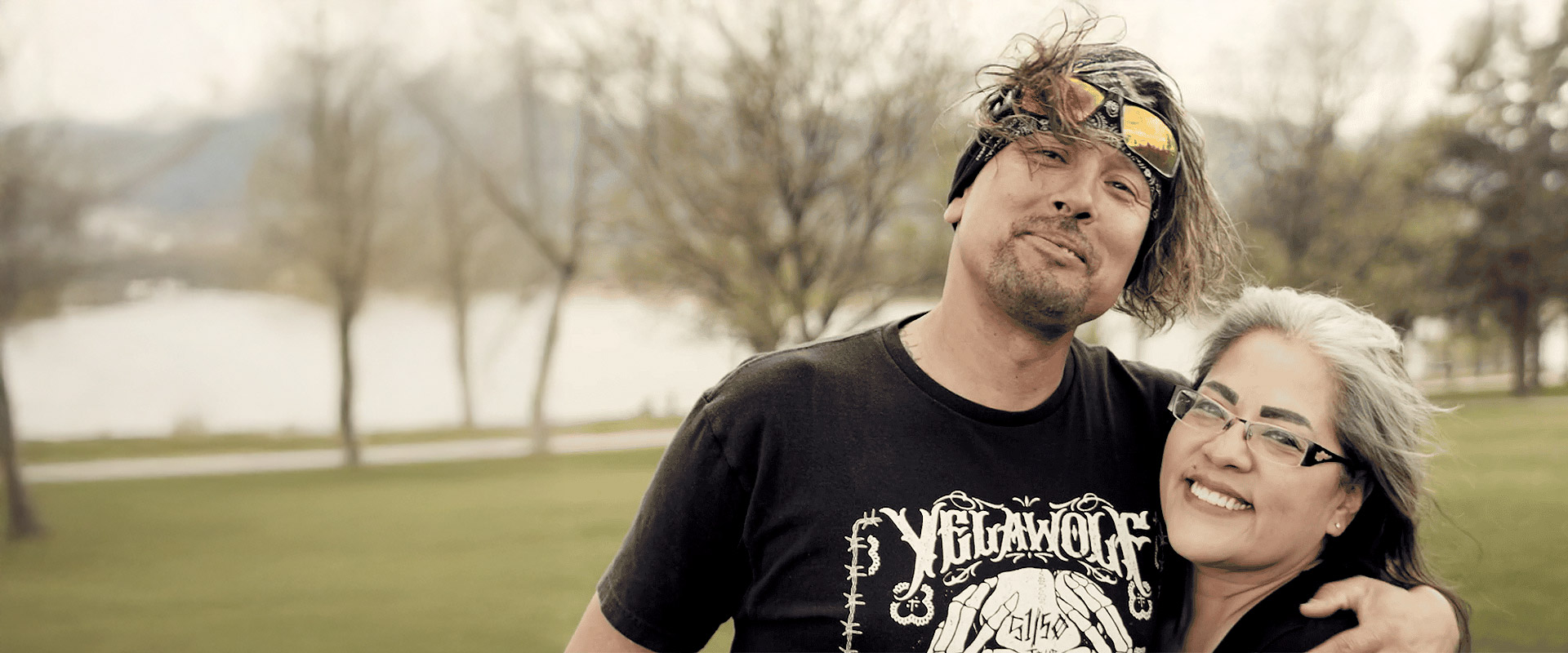 Man and woman shoulder hugging