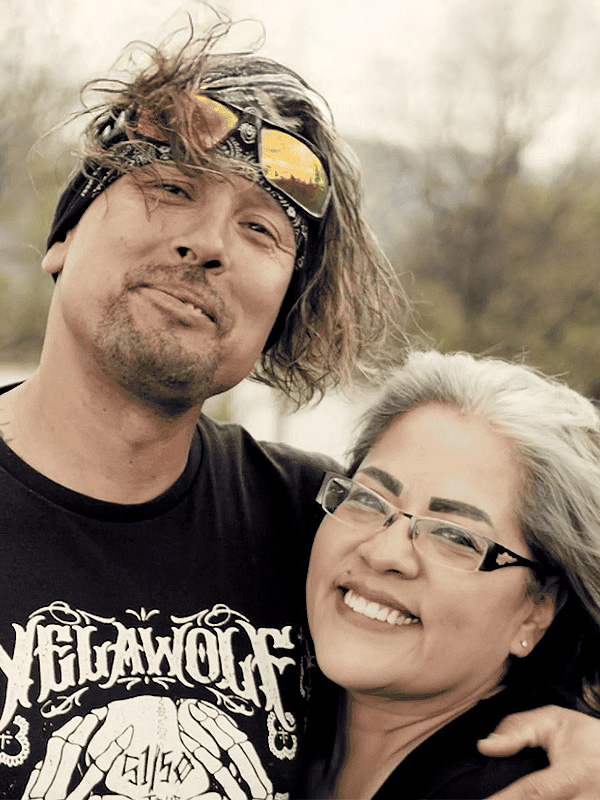 Man and woman shoulder hugging